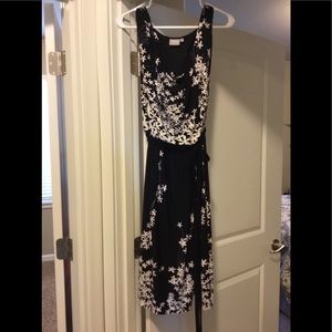 Black Eshatki dress with small white flowers.